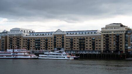 London, United Kingdom - October 18 2018:   The front of Butler's Wharf building on the Southbank, over looking the River Thames. Formerly a biscuit factory, now luxury flats and restaurantsのeditorial素材