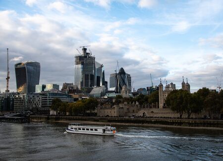 London, United Kingdom - October 18 2018:   A Passenger ferry travelling along the River Thames past...