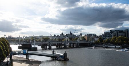London, United Kingdom - October 18 2018:   The View West along the River Thames from Waterloo Bridge, with Hungerford Bridge, Charing Cross Station and Festival pierのeditorial素材