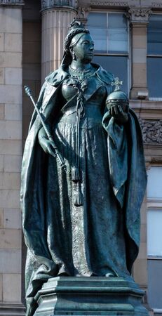 Birmingham, England - March 17 2019:   A statue of Queen Victoria created by Thomas Brock in 1901 in Victoria Squareのeditorial素材