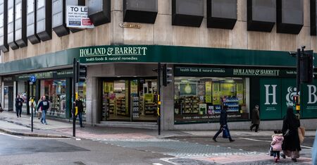 Birmingham, England - March 17 2019:   The Entrance to Holland And Barrett heath foods store in High Streetのeditorial素材