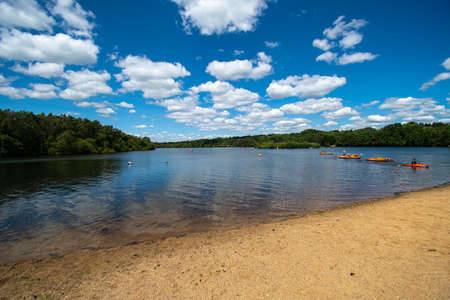 Sandhurst, United Kingdom - June 22 2019:  Canoeists on a sunny day on Horseshoe Lakeのeditorial素材