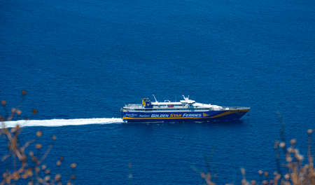 Megalochori, Greece - July 17 2019:   A Golden Star Ferry on it's way to Fira passes the headland near Megalochoriのeditorial素材