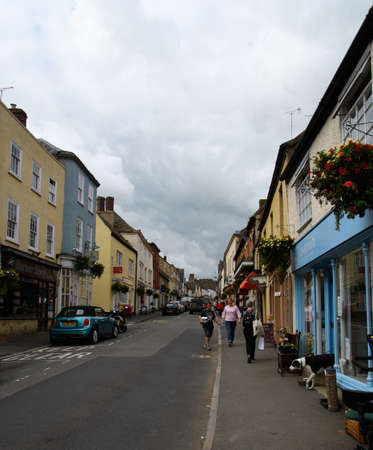 Wotton-Under-Edge, United Kingdom - September 07 2019:   Shoppers wander amiongst the village centre shops on Ludgate Hillのeditorial素材
