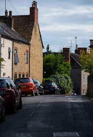 Wotton-Under-Edge, United Kingdom - September 07 2019: A narrow country village lane runs along Potters Pondのeditorial素材
