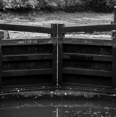 Guildford, United Kingdom - November 06 2019:  The exposed top gate of a drained canal lock on the...