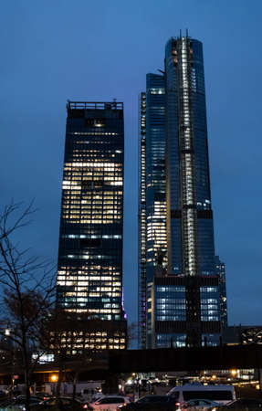 Lit Skyscrapers stretch into the New York night sky