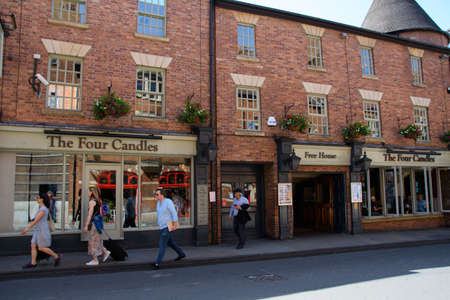 Oxford, United Kingdom - June 29 2019:   The frontage of the Four Candles pub in George Streetのeditorial素材