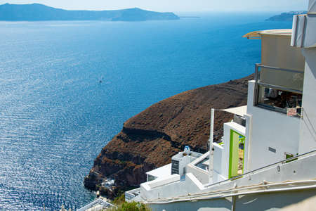 Perissa, Greece - July 18 2019:   The shops restaurants and beach bars along the sea front roadのeditorial素材