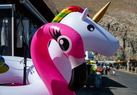 Perissa, Greece - July 18 2019:   The shops restaurants and beach bars along the sea front roadのeditorial素材