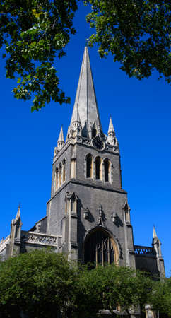 The spire of St James Church Sussex Gardens againsta bright blue skyの写真素材