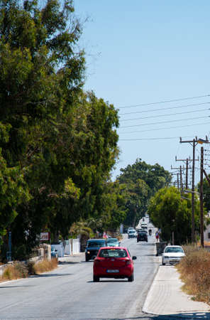 Perissa, Greece - July 18 2019:   Looking down a long straight section of the Fira to Perissa roadのeditorial素材