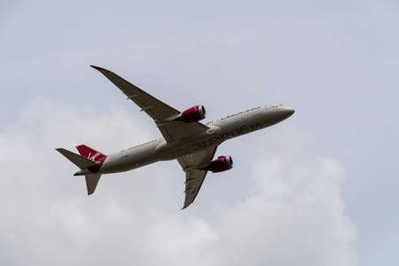 Heathrow, United Kingdom - August 03 2019:   Virgin Atlantic Boeing 787 Dreamliner registration G-VFAN,  flight number VS105 departs Heathrow airport en route to Seattle seen from Myrtle Avenueのeditorial素材