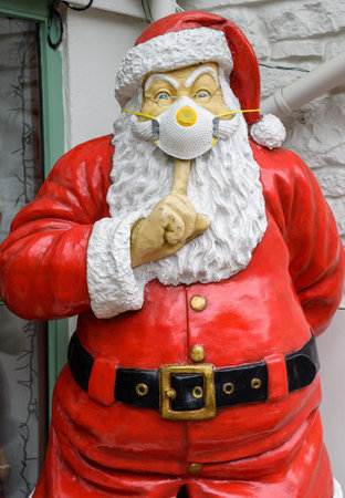 Cheddar Gorge, United Kingdom - August 23 2020:  A statue of Santa Claus wearing a face mask in teh light of the Coronavirus Pandemicのeditorial素材
