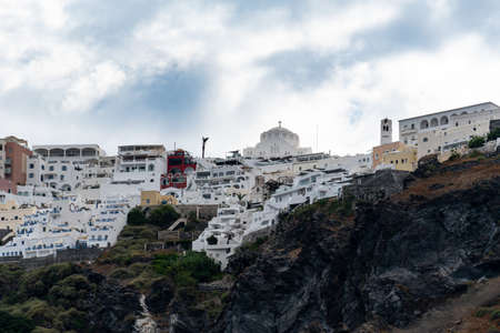 View of the town of Fira as seen from the Aegean Sea in Santoriniの写真素材