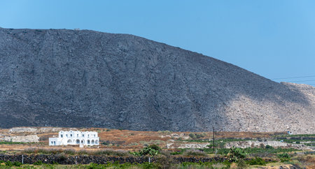 A lone whitewashed house sits in the lowlands of Mount Profitisの写真素材