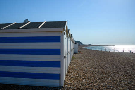 Hastings, United Kingdom - July 31 2020:  A line of beach huts on Hastings beach on Verulam Placeのeditorial素材