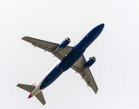 Heathrow, United Kingdom - August 03 2019:  British Airways Airbus A320-232 registration G-EUYG,  flight number BA1482 departs Heathrow airport en route to Glasgow seen from Myrtle Avenueのeditorial素材