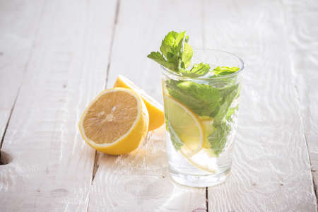Soft drink with lemon, ice and mintの写真素材
