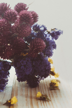 Dried flowers on a wooden table close-upの写真素材