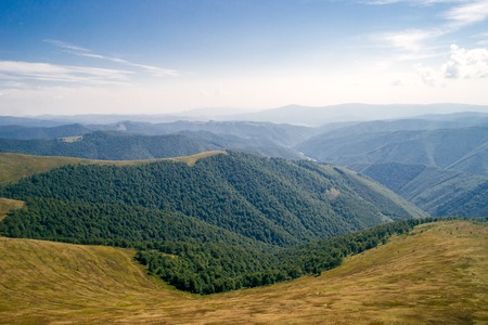landscape with it's beautiful mountains and forests on a sunny day of spring.の写真素材