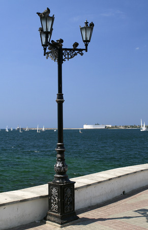 Old metal street lamp on the waterfront of Sevastopolの写真素材