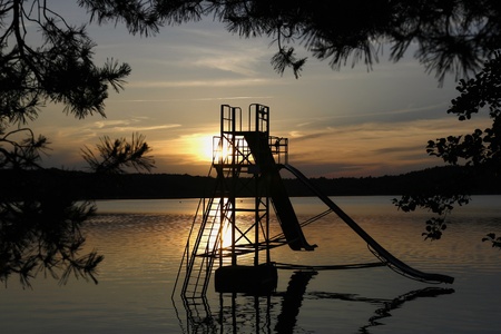 Water slide at the Lake Macha (Czech: M?chovo jezero) - an artificial lake (fish pond) in the Liberec Region - a traditional holiday destination in the Czech Republic.の写真素材