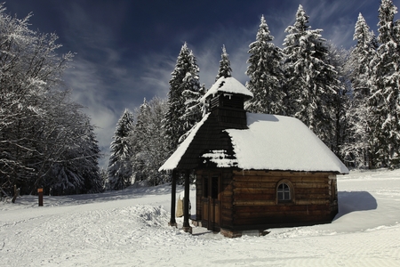 Wooden chapel in a popular ski and cross-country ski resort Paprsek in the Golden Mountains (Czech: Rychlebske hory), Czech Republic.の写真素材