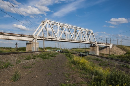 Large railway bridge at the intersection of railway linesの写真素材