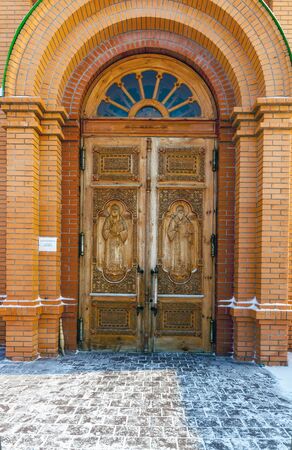 Carved wooden Orthodox icons on the door frameの写真素材