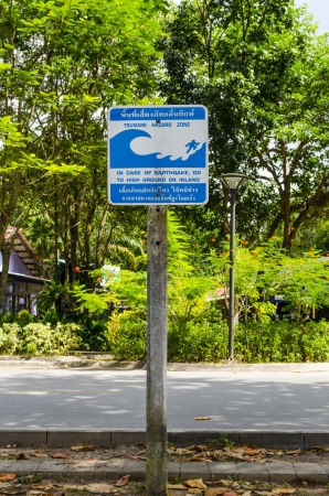 Sign warning about the danger of a tsunamiの写真素材
