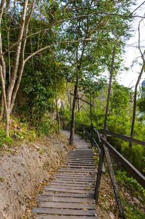 Wooden path on the cliff by the sea in Thailandの写真素材
