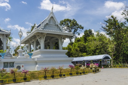 Thai Buddhist temple decorated with white ornaments with dragons and lanternsの写真素材