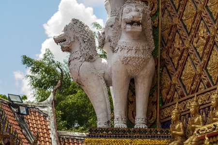 Buddhist sculptures of mystical creature in the interior of a Buddhist temple in Thailandの写真素材