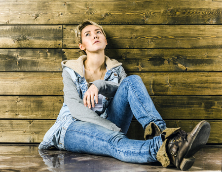 Young blonde girl with short hair in casual wearの写真素材