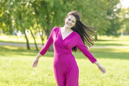 Beautiful girl in a summer dress in a Russian parkの写真素材
