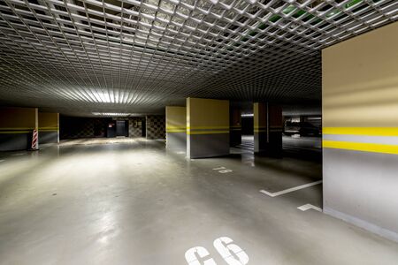 Underground garage with lighting and concrete roadの写真素材