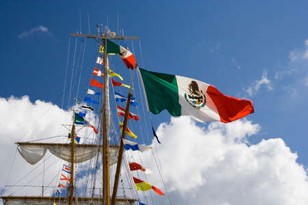 Mexican flag on the top of the tall ship.の写真素材