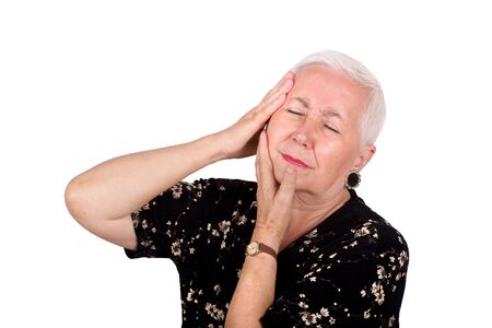 Old woman with toothache, isolated on white background.の写真素材
