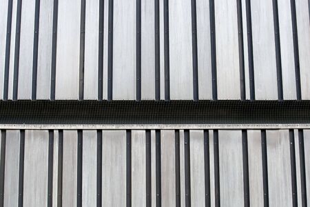 Futuristic metallic wall building background.の写真素材