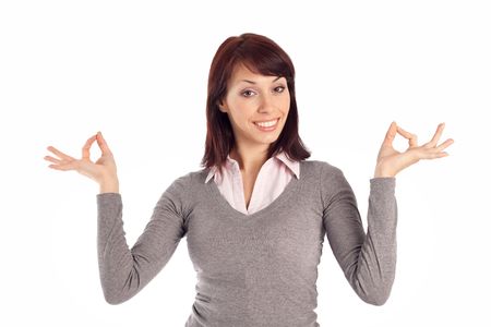 An isolated on white shoot of a beautiful young woman showing an OK sign with both hands.の写真素材