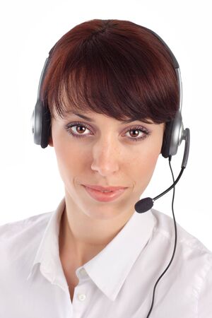 Friendly female customer service representative with headset, isolated on white background.の写真素材