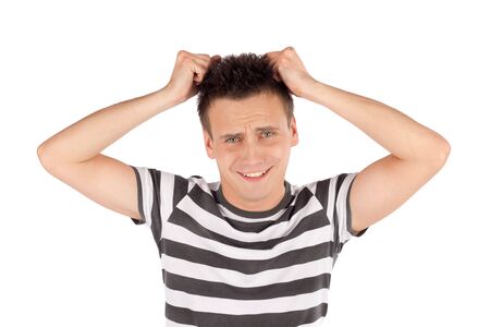 Young man pull out his hair isolated against white backgroundの写真素材