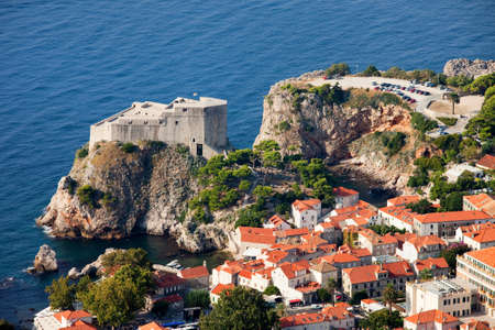 Dubrovnik city houses and the Fort Lourijenac on the Adriatic Sea in Croatiaの写真素材