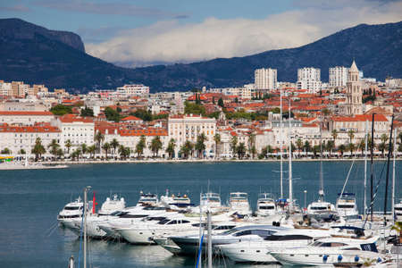 Split cityscape on the Adriatic Sea in Croatia, motorboat harbor in the foregroundの写真素材