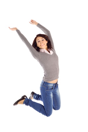 Happy joyful young woman jump into the air isolated on white backgroundの写真素材