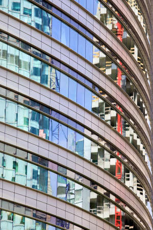 Modern round office building abstract architecture, reflections on windows.の写真素材