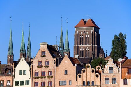 Old Town houses with Church of the Blessed Virgin Mary (Polish: Bazylika Mariacka) in the background...