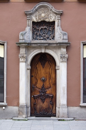 Richly decorated antique door on a historic apartment house in the Old Town of Gdansk, Polandの写真素材
