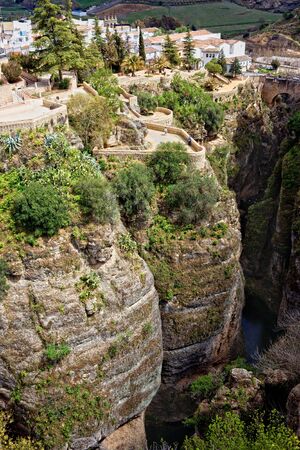 Ronda town on the high cliffs of Ronda Gorge in Andalucia region of Spain, Malaga province の写真素材